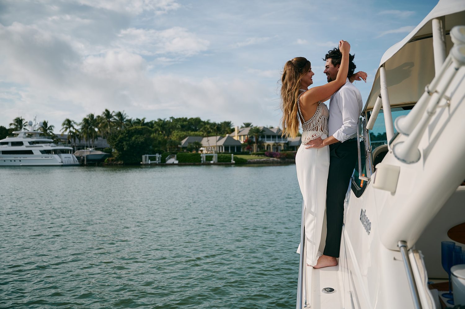 A wide embrace on the water, the coastline behind