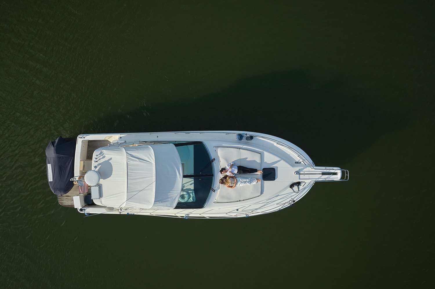 From above — the boat alone on green water