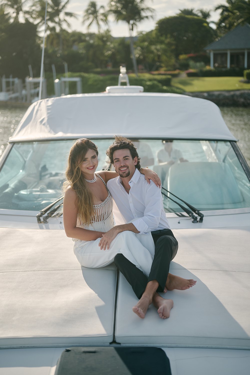 Stretched out on the bow, the shore behind them