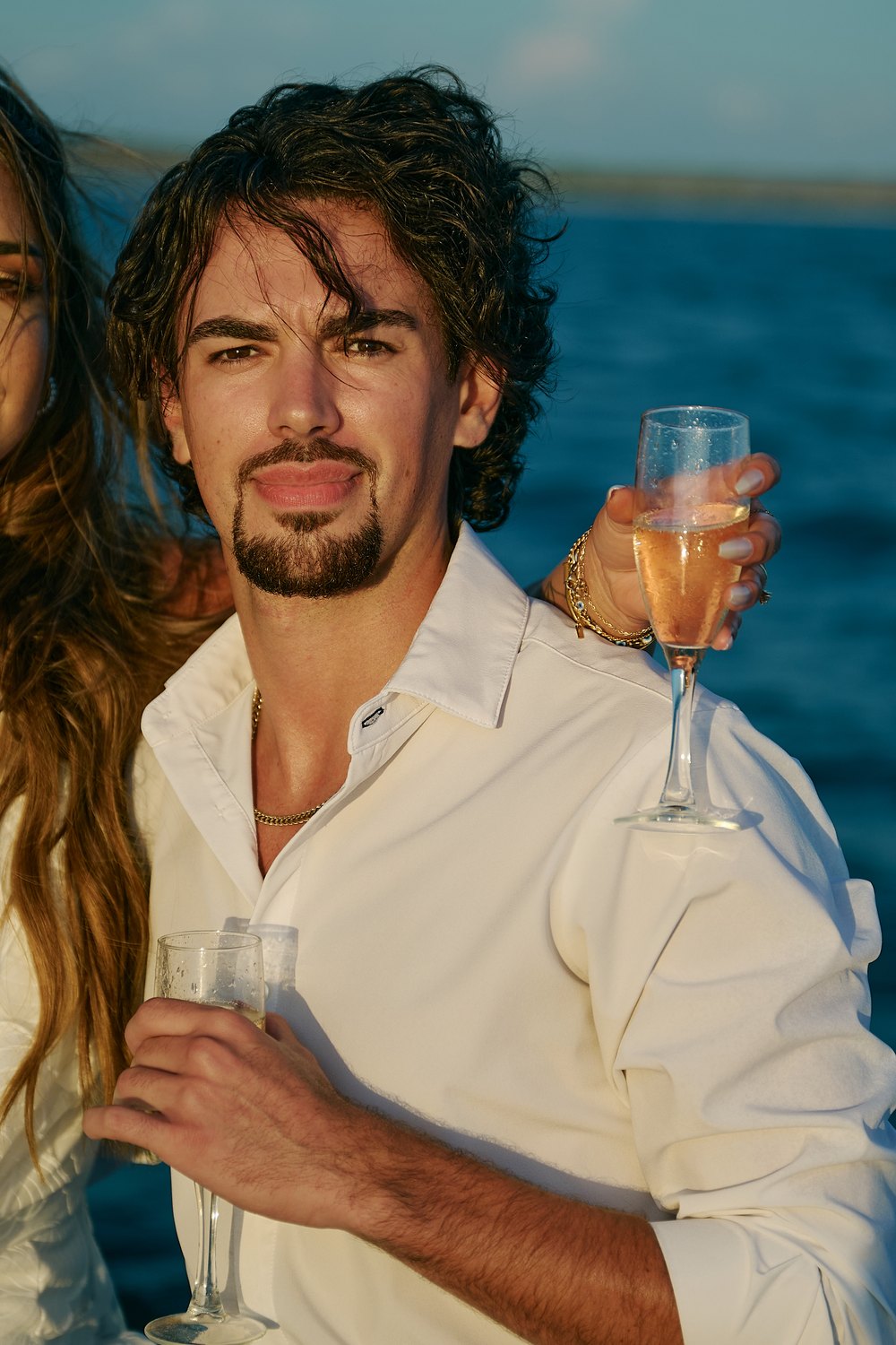 Jaden, champagne in hand