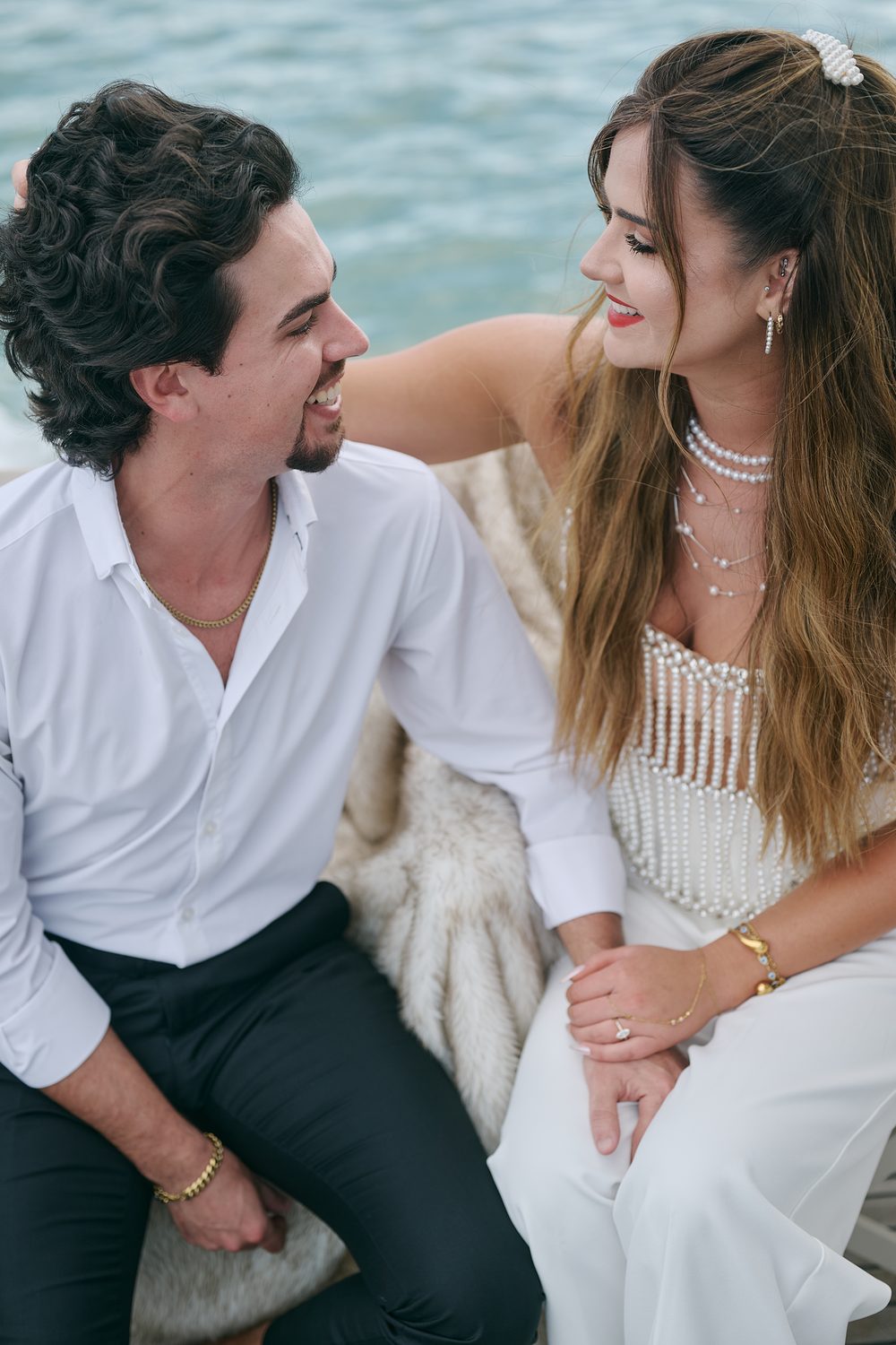 Laughing together, close, over the water
