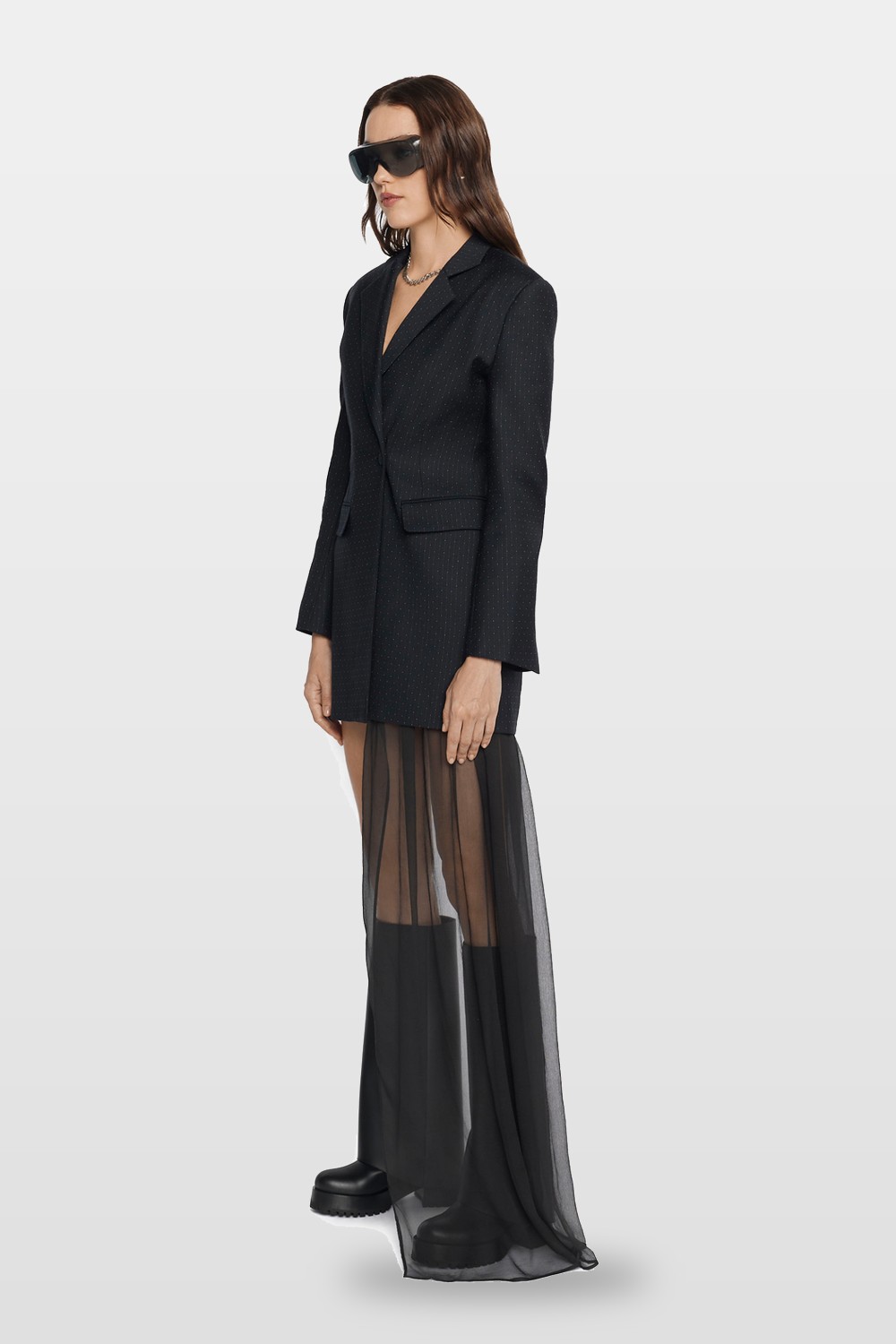 An oversized blazer over a sheer maxi