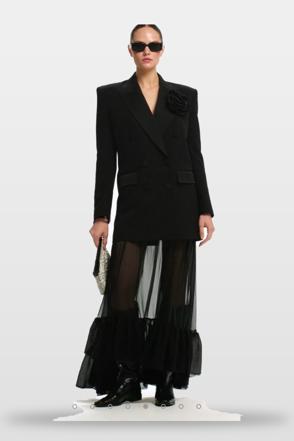 A sharp blazer over sheer layers