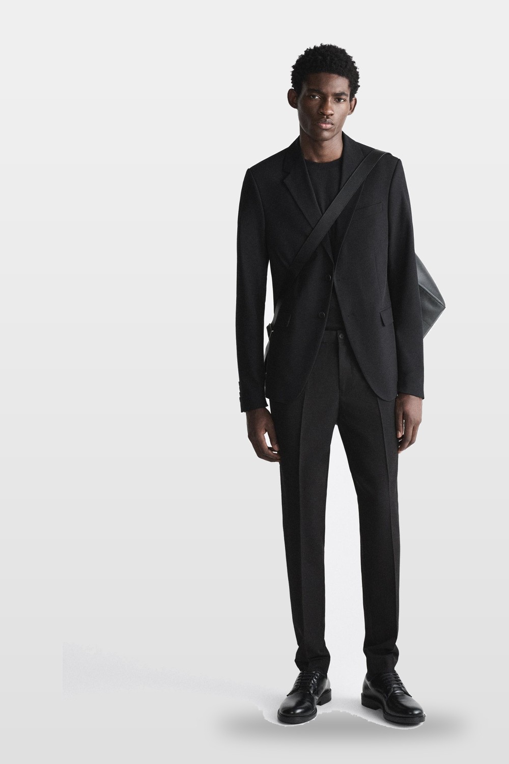 A black suit over a black tee